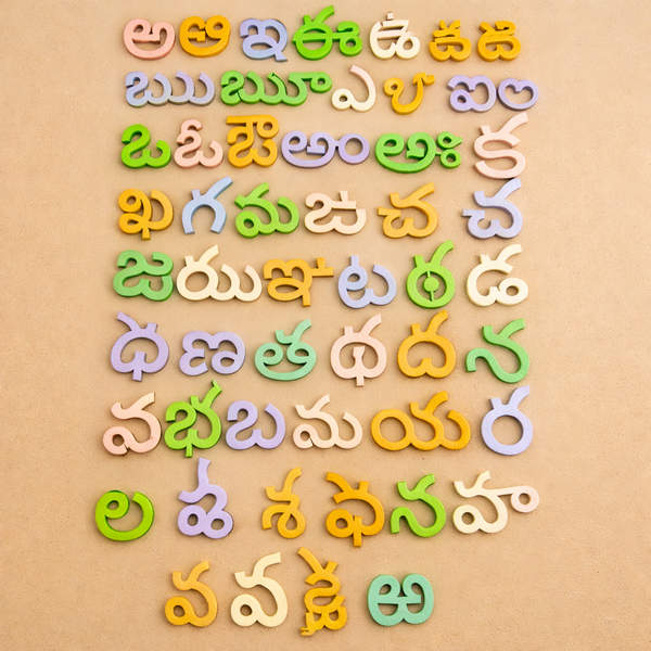 Wooden Telugu Varnamala board with all alphabet letters placed, showing vibrant colors.