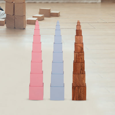 Casa Bambini Not So Pink Tower assembled: 10 graded mango-wood cubes stacked largest to smallest