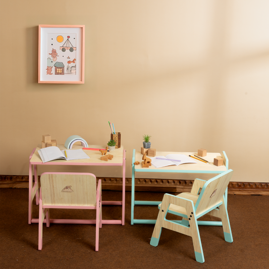 Toddler seated at adjustable Montessori workstation, front view, engaged in activity.
