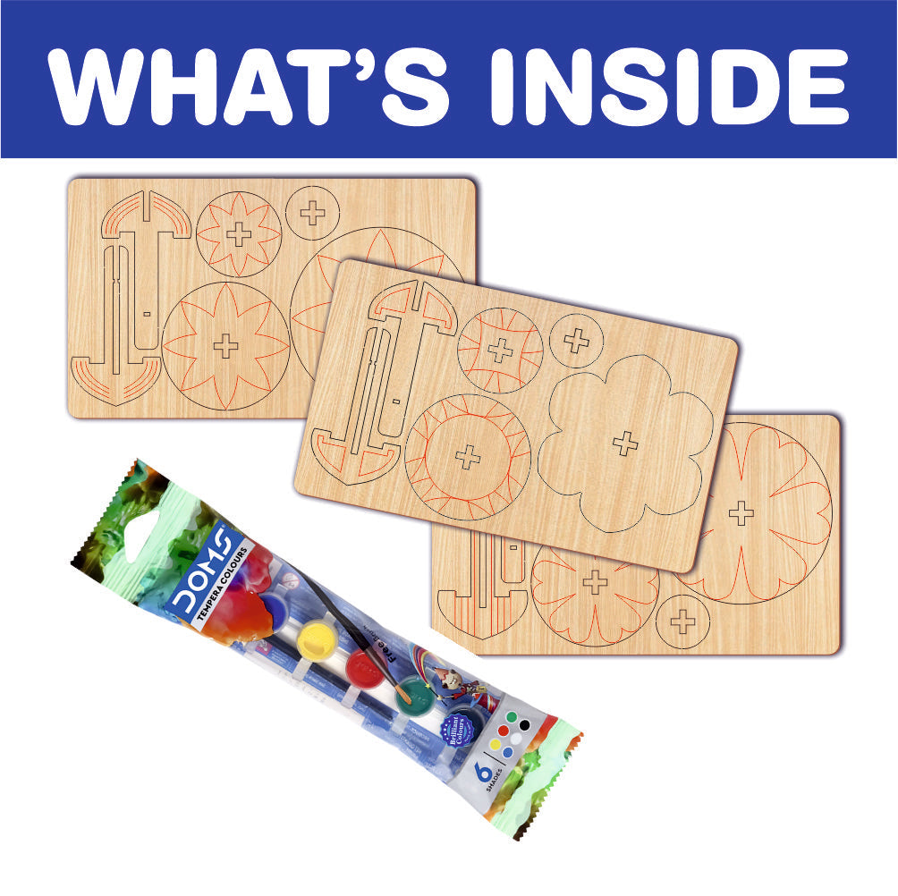 Components of the DIY Spinning Top Craft Kit laid out: wooden parts, paint pots, and brushes ready for assembly.