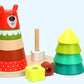Wooden Bear Stacker toy with colorful rings and geometric shapes