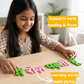 Close-up of a child's hand placing a wooden Hindi letter onto the puzzle board.