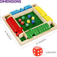 Children playing the Shut The Box game, close-up of dice and wooden number tiles