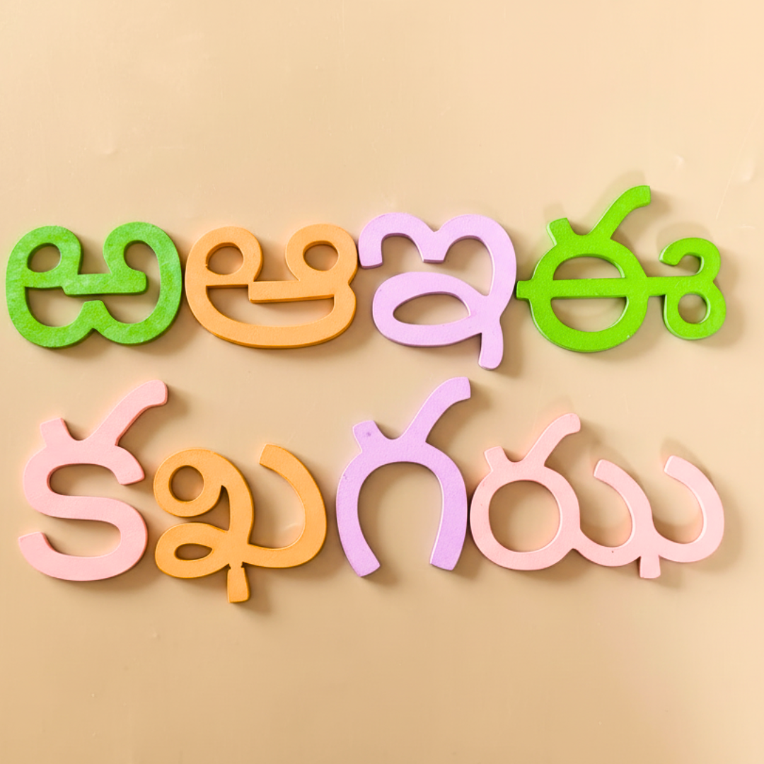 Interactive wooden learning board for Telugu language, promoting early literacy skills.