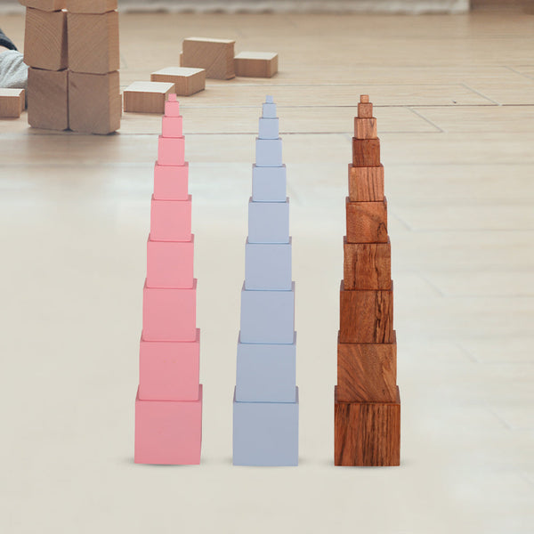 Casa Bambini Not So Pink Tower assembled: 10 graded mango-wood cubes stacked largest to smallest