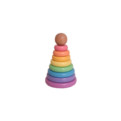 Toddler reaching to place a ring on the Casa Bambini Wooden Ring Stacker, learning size order and hand-eye coordination